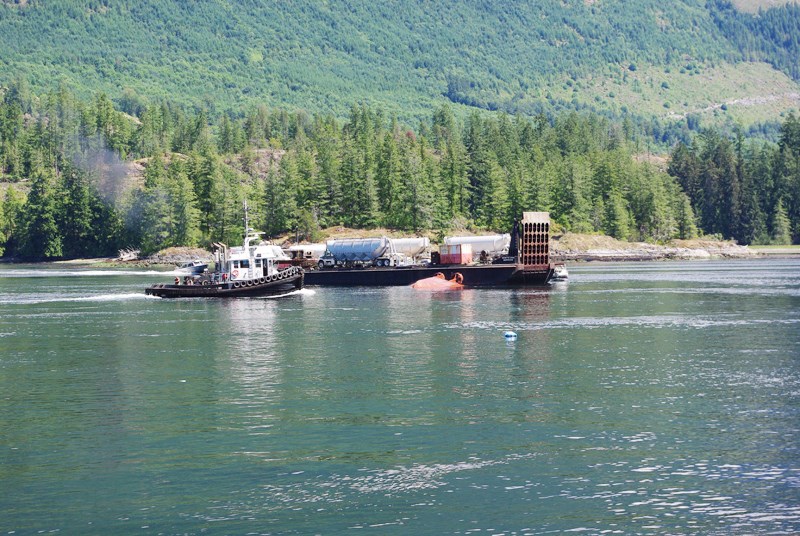 Four men were rescued from the waters of the Skookumchuck Narrows on Sunday afternoon, July 19, when the 13-metre tugboat they were on suddenly flipped.