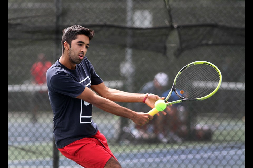 Burnaby Open Tennis Championship at the Burnaby Tennis Club, Sunday, June 29, 2014.
Javeed Kassam of Vancouver competes in the men's 5.0 division.
Photo by Jean Konda-Witte