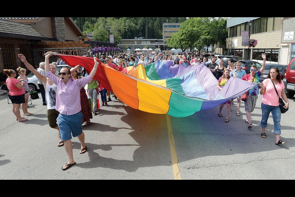 The Pride flag was carried down George Street to lead the 18th annual parade Saturday in Prince George.