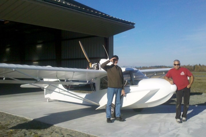 Michael Weir, left, and Gerald Thom with the plane they built.