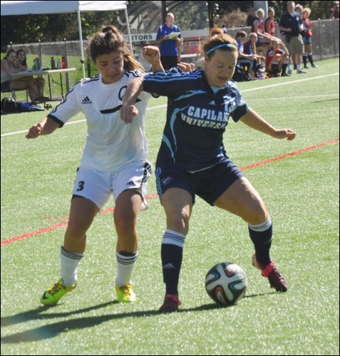 Quest’s Gabriella Villasenor battles for the ball with a Blues defender.