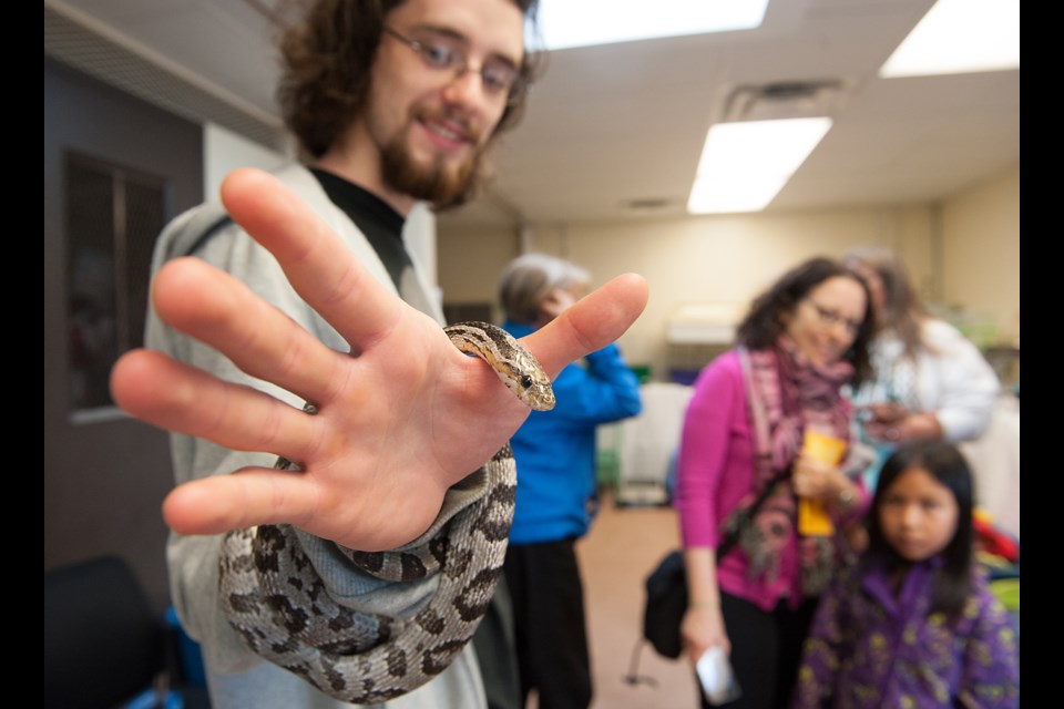 Brayden Bull adopted Calista from a small animal rescue group that set up on the site of the Vancouver Animal Control Shelter as part of Doors Open Vancouver day, Saturday. Photograph by: Rebecca Blissett