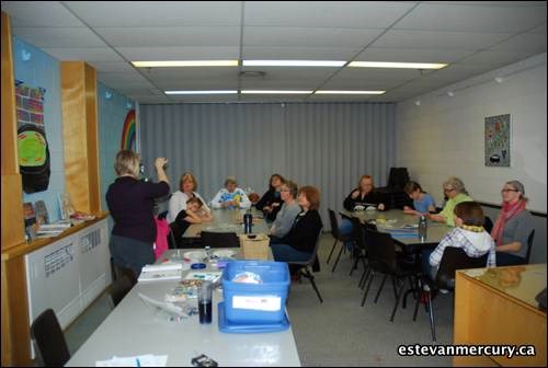 Instructor Taren Trew explains what they jewelry making participants had to do for their pieces.