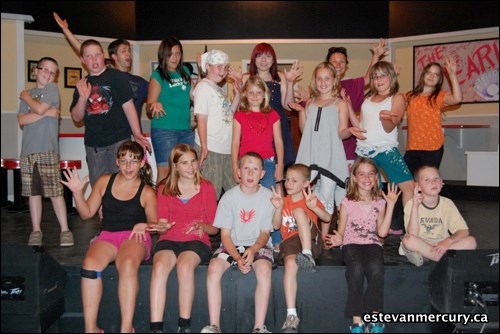 This year's musical theatre camp attendees pose on stage at the Souris Valley Theatre