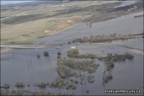 A roadway lies sunken beneath the water's surface.