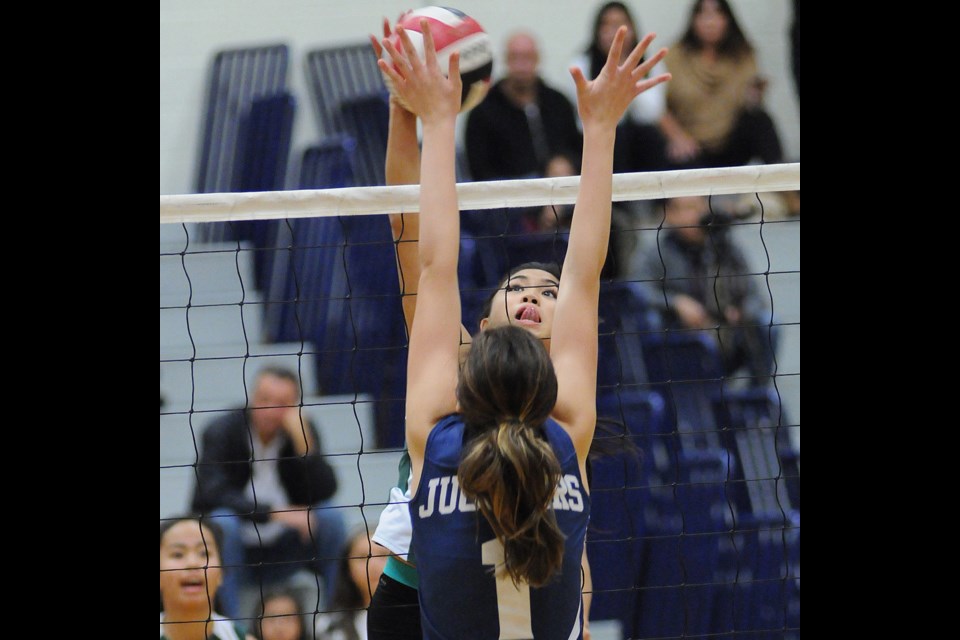 St. Patrick’s Celtics hitter Beatrice Soberano makes a play at the net in a quarterfinal win over the Notre Dame Jugglers in the B.C. Catholics championship at Notre Dame secondary Oct. 24, 2014. Photo Dan Toulgoet