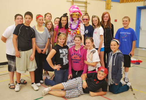 Manor School raised a total of $6,000 during their annual Terry Fox Run to meet their goal. As a result, students were able to dress up staff members for the run. Pictured here are Ms. Kelly Pattison and the grade 7/8 class who decided on her attire.