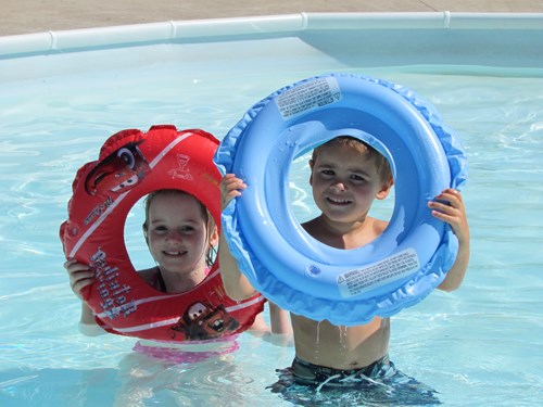 Six-year-old Vashti Wardrope, and two-year-old Kaeden Wardrope, display their water toys.