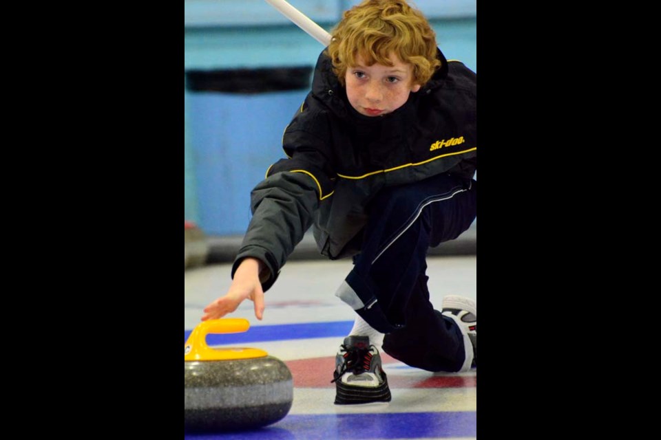 Delan Robertson works on his throwing technique at the Carlyle Curling Club.