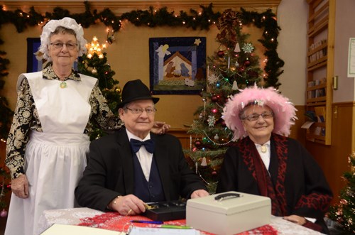 When people walked through the large wooden doors of the Carlyle United Church for the High Tea on Dec. 3, they were kindly greeted with a smile from Ida and Al Scott, and Alice Savill.