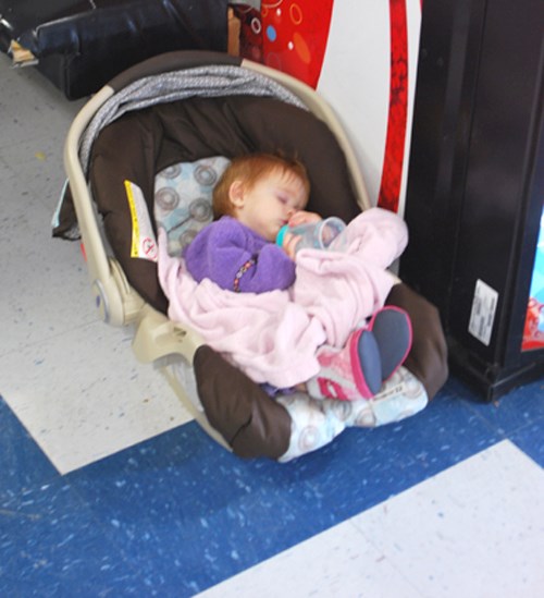 The day&#8217;s excitement was a little much for some of the children who attended the Skate-a-thon. Alix Rae has opted for a nap in the warmth of the waiting room.