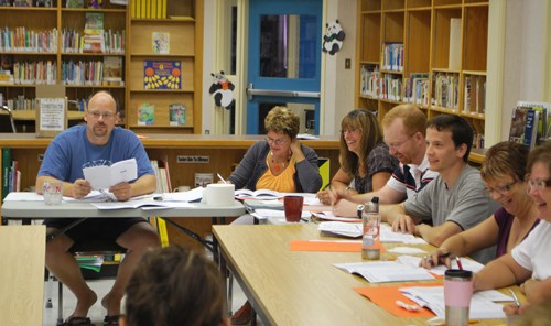 The first day back to school was actually Monday, Aug. 24 for the teachers and staff of the schools throughout the region. Planning and policy changes made for a busy day for many of the teachers. Here the Arcola School faculty sit in the school library covering some of the changes for the new year.