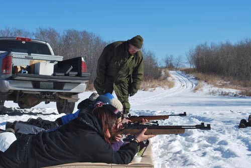 Marksmanship training was one of the items on the agenda for the cadets of Moose Mountain&#8217;s 723 Squadron of the Air Cadets. Here Lt. Phil Harrison inspects pellet rifles along the firing line.