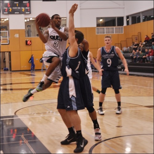 Quest's Dallas Searles gets some hang time on a jumper during Quest's game against Capilano on Friday (Oct. 31).