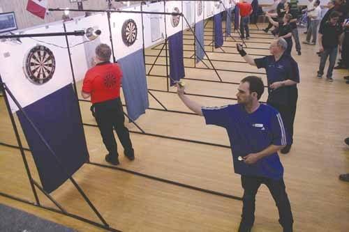 Royal Canadian Legion dart players from across the province gathered at the Royal Alexander Ross Branch hall in Yorkton on the weekend for provincial play. In the Open Event Ron Strohan of Nutana branch #362 topped singles, then teamed with Wayne Goldsworthy to take the doubles crown. Claude Washburn, Ed Bell, Pat Ladouceur and Bill Parkman of the Hudson Bay branch #13 took team honours. In the Closed Event; John Brann of Moose Jaw branch #59 took singles, then teamed with Curt Gamble for doubles honours. The duo then joined Jesse Gamble and Jeff Berner for team honours.