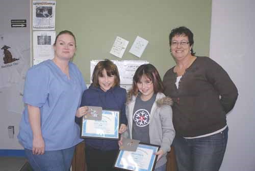 Ten-year-old Chrissy Powers of Yorkton received a Certificate Of Appreciation from the SPCA for her local fundraising efforts which brought in $1,845. Chrissy approached the local SPCA about door to door fundraising. &#8220;People were surprised and happy and there are a lot of dog lovers,&#8221; said Chrissy. Chrissy and her family adopted twin retrievers three years ago. Pictured above (from left to right) is Trina MacNeil with the SPCA, Robyn and Chrissy Powers and SPCA manager Joan Kobylko.