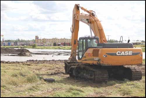 During heavy rains early last week, blocked culverts impeded drainage from the Dracup Avenue Storm System currently under construction in Yorkton. Although the city received only one to two inches of rain in a 24-hour period, some freshly dug channels at the construction site filled with more than seven feet of water, bringing progress to a halt. Most of the water was pumped out or drained within a day, and work resumed.