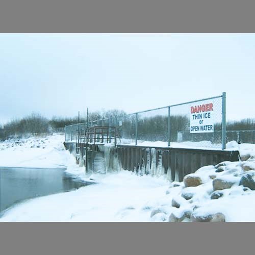 Grant Dupe of the Sask. Water Shed installed a sign on the Good Spirit Control Structure this past weekend to warn snowmobilers and skiers of the potential danger of thin ice around the structure and the cannel. With the early snow cover the water has had no chance to freeze deeply and can appear to be snow covered and yet be water underneath. The Structure will remain open to lower the lake by another 2 feet which will hopefully make room for next spring&#8217;s runoff. Grant states that caution should be taken when around this area until that level is achieved and the spill way is closed to allow for the water to freeze to a safe thickness.