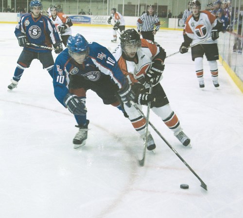 The Yorkton Terriers and Melville Millionaire hooked for the first time this Saskatchewan Junior Hockey League season with back-to-back games. Friday night the teams played to a shoot-out in Yorkton at the Farrell Agencies Arena. Here Terrier Robbie Ciolfi (91) and Millionaire Justin Hollinger battle for the puck. For more on the game, see Page B1.