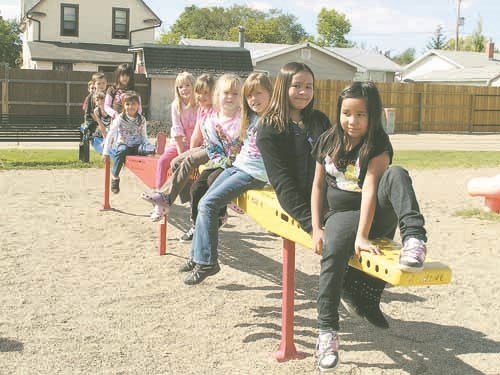 St. Alphonsus students from Kindergarten to Grade 8 enjoy a ride on the X-wave at the playground during recess time.