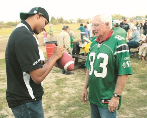 Friday night was Riderville at the Races night at Cornerstone Raceway in Yorkton. In addition to the usual night of Standardbred harness racing, former Saskatchewan Roughrider stand-out Matt Dominguez was on hand signing autographs like the football won by Jim Nichols of Yorkton. For more coverage on the event see Pages A10 and C1.