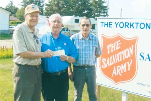 A $1000 cheque was presented to the Salvation Army, Yorkton branch in support of flood relief.  Making the United Commercial Travellers # 578 presentation to Major Roy Bladen (centre) is John Miller (left) President and Floyd Fenske Secretary-treasurer (right) of the local charity.