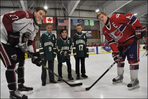 Keegan Jones of the Vancouver NW Giants and Ronnie Wilkie of the Vancouver NE Chiefs await the ceremonial pick drop from SMHA players (L-R) Joseph Harvey, Max Kleban and Austin Cranfield before Saturday's (Nov. 1) game.