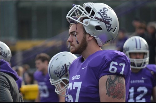 Tyson Thompson observes play on the sidelines. The 鶹native recently completed his second season with the Bishop’s Gaiters.