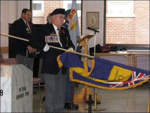 Royal Canadian Legion Provincial Vice-President Ray Hickson lowers the standard during the Saskatchewan Hospital Remembrance Day ceremony.