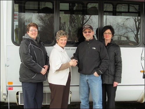 Sanberg Collision has donated an awning for Battlefords District Care Centre handi-bus. This awning provides shade for the residents on their many summer outings, allowing them to enjoy their time outdoors without the worry of excessive sun exposure. In the photo recreation therapist Lori Nachtegaele, retired facility manager Carol Dyck  and, Ray and Sheila Lessard, owners of Sanberg Collision.