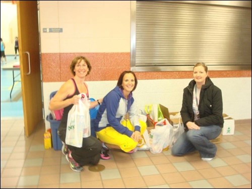 Zumba with Rena held a fundraiser for the Empty Stocking Fund Dec. 10 at Holy Family School.There were approximately 45 people in attendance and everyone donated food and toys for admission to the class. Zumba instructors Nicki Holtzhausen and Rena Fauchon~Smockum and Empty Stocking Fund co-ordinator Erin Hoffman admire the donations collected.