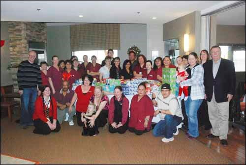 The Battlefords Empty Stocking Fund received a boost from Gold Eagle Lodge on Wednesday afternoon. 
The occasion of their annual Associates Christmas Party was chosen to present the Empty Stocking Fund with food hampers and children&#8217;s gifts for four families that the Gold Eagle Lodge associates will be sponsoring this Christmas. 
Empty Stocking Fund executive director Bill Hall was on hand to accept the donation from general manager Malcolm Anderson and the rest  of the staff.