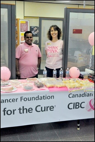 awareness and proceeds for the Canadian Breast Cancer Foundation and the local CIBC branch had several ways to support the cause. A book sale, which began Sept. 6, ended Friday along with the sale of pink CIBC merchandise. The bank also had a bake sale Friday, as they raised more than $1,000 for the CIBC Run for the Cure. Friday Suketu Shah, a financial services representative, and branch manager Evelyn Brown stand in the office looking out on the bake and book sale, which was all donated through the work of the bank branch staff members.