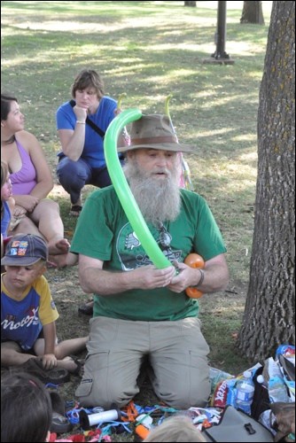 Balloon guy Larry Goodall draws an appreciative crowd.