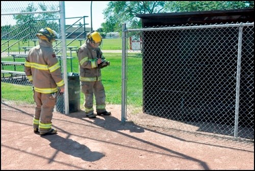 It isn&#8217;t unusual to see uniforms on the baseball diamond in the summer time, but Monday, the uniforms on the Lions Club ball diamond behind the North Battleford Civic Centre were those of firefighters not ball players. North Battleford Fire and Emergency Services responded to a call around 2:30 p.m. and wasted no time containing the reported fire in the dugout at the ball diamond. The bench, rear wall and roof sustained minor damage, but upon first inspection no renovations need to be made to the dugout.