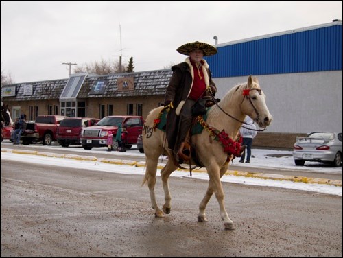 Cowboys and cowgirls paraded through the streets of Battleford Saturday during the fourth annual Cowboy Christmas Parade. The riders and other supporters collected pledges for the Empty Stock Fund as well as selling 50/50 tickets. Santa joined the fun, also accepting toys for the annual Christmas program.