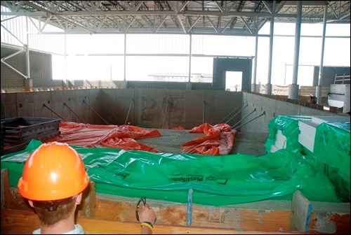 A tour of the CUPlex construction site May 20 offered a glimpse of the facility&#8217;s future. The aquatic centre and theatre components were the highlights. This photo shows the foundation for the swimming pool. The round holes in the pool will be fitted with underwater lights, while windows will allow plenty of natural light to stream in. Water slides will be housed in a tower to the right