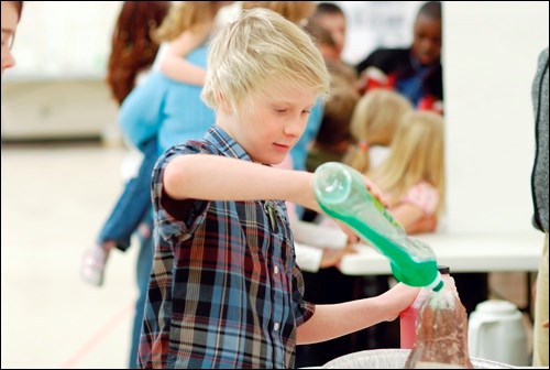 Luke Hoiland, a Grade 4 student at École Père Mercure, demonstrates his explosive science project during the school&#8217;s science fair. The winning project will have the opportunity to compete in the Expo-Sciences Primaire, a provincial science fair open to Grades 4 to 6 in French schools. The Expo will be held in Regina in early April.