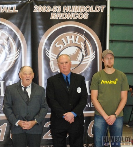 The night before the formal induction ceremony for the Saskatchewan Junior Hockey League Hall of Fame, held in Humboldt, the inductees, including members of the 2002-03 Humboldt Broncos, the first team to be inducted into the Hall of Fame, were honoured with a ceremony at the Elgar Petersen Arena during the Broncos home game.  From left: Elgar Petersen, former coach Bob Beatty and Russel Gehlen.