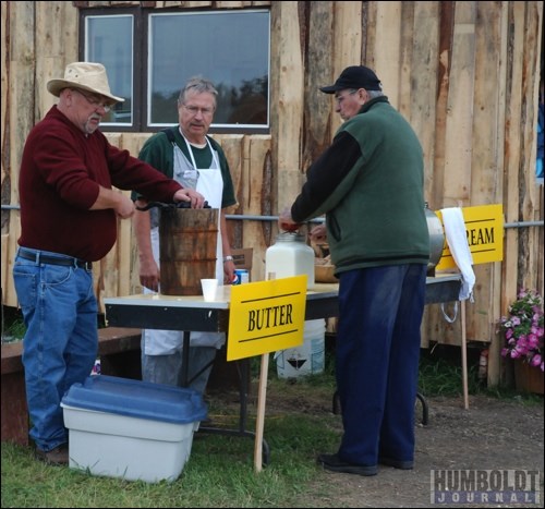 Tony Stroeder (left) churned homemade ice cream for people to taste, while Ken Klassen took a break from making butter.