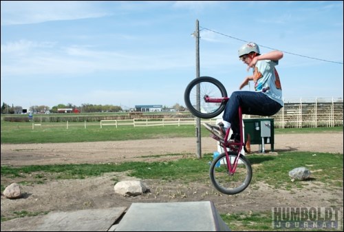 Michael Skoronski catches some air on his bike at the Humboldt Skate Park on May 19. He joined a few other skateboards and bikers out to perfect some tricks.