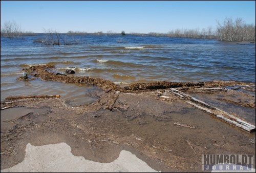 The flooding of Waldsea Lake continued this week.  Water has now completely covered the road that once led into the park, the baseball diamonds and is cresting over what was once a grid road that travelled north along the east side.   In the distance, where two spruce trees are visible, is where cabins once stood behind a berm. The water levels at Waldsea Lake were expected to go up 15 feet this spring in a plan that involved sacrificing the park to save agricultural land around Deadmoose and Houghton lakes.