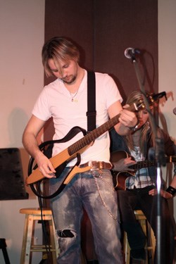 Steve Gibson performs at the Songwriter's Circle, recently held in Yorkton at the Army, Navy and Airforce Veteran's Club. The event brought together seven up-and-coming country artists from the area to talk about how they write their songs and perform. The event is held by the Saskatchewan Country Music Association, to help promote talented country artists throughout the province.