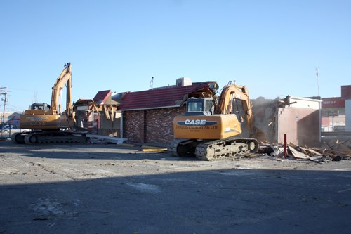 To rebuild, one must first destroy, and the Dairy Queen on Broadway was torn down on Monday, after severe flood damage earlier in the year made the building unsuitable to continue to be used. Owner Mark Butchko says that he is relieved to see it go down, as it means insurance has finally come through and the process of rebuilding can begin. He expects that construction will begin next March, and the new location to be open in September of 2011. Butchko also says that he hopes to use as much local labor and tradespeople as he can. &#8220;I believe that you&#8217;ve got to support local, if you want the city to grow you&#8217;ve got to spend the money in town,&#8221; Butchko says.