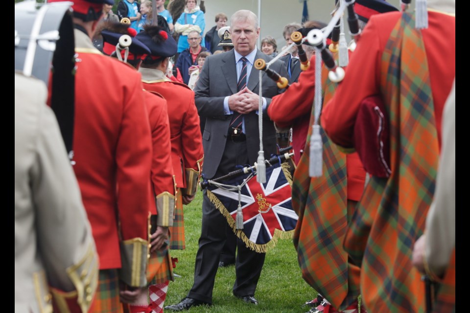 Prince Andrew chats with members of the 76th Fraser Highlanders Fort Victoria Garrison during the 150th Highland Games at Topaz park.