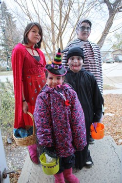 Local children were out in full force Monday evening as milder temperatures made for a great day for trick-or-treating. Pictured above (l-r) are: Amy Esquash; Marissa Pelties; Lonnie Pelties; and Cole Esquash.