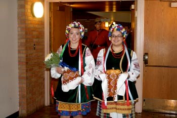 Premier Brad Wall received a warm, traditional Ukrainian welcome to Yorkton and to St. Mary&#8217;s Ukrainian Cultural Centre last week when he visited the city to speak at an annual Yorkton Chamber of Commerce Premier&#8217;s Dinner event. Pictured above making a grand entry into the hall are Kaitlyn Polegi and Lindsay Villeneuve.