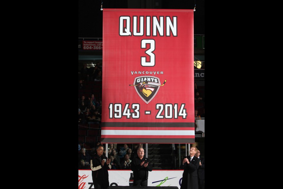 The 鶹ýӳGiants paid tribute to late minority owner and former NHL player Pat Quinn by raising the number of the former NHL player to the rafters of at Pacific Coliseum on Dec. 5, 2014. Looking at the banner, from left to right, are Sultan Thiara, Ron Toigo and Lewis Buble.