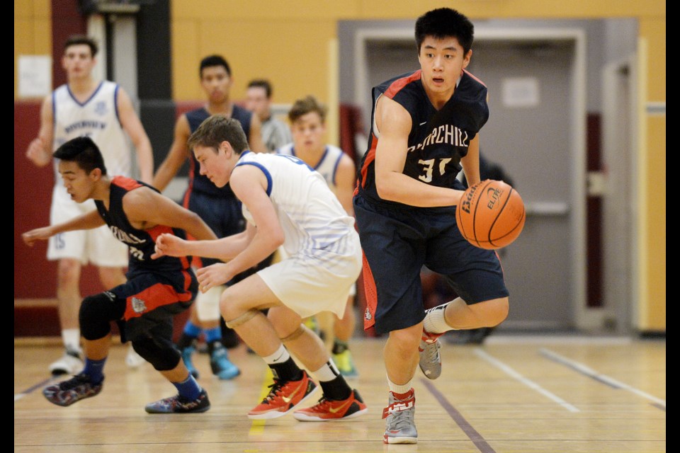 Churchill's Harry Lui (No. 31) steals the ball against Sydney, Australia's St. Ignatius school in the Heritage Woods Invitational in Port Moody Dec. 6, 2014. Photo Jennifer Gauthier