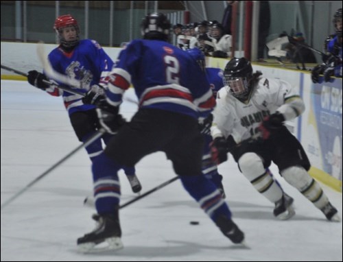 Squamish's Brendan Hopkins dekes through the Cloverdale defense on Saturday (Jan. 17).